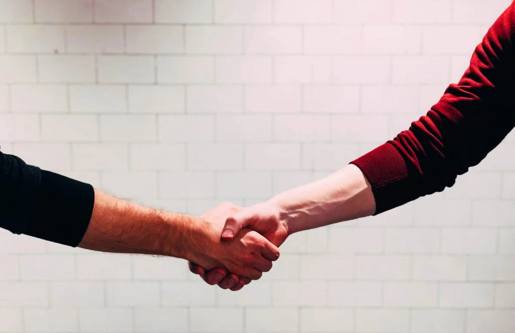 people-shaking-hands-scaled