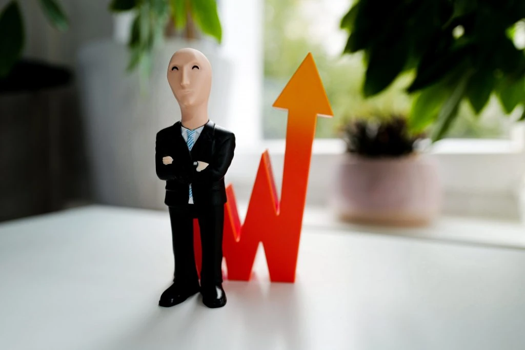 toy in front of interest rate arrow scaled